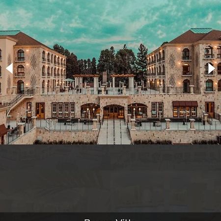 Buona Vitta Gramado Resort & Spa By Gramado Parks Exterior photo The photo shows a spacious and elegant building design, likely a hotel or resort. The structure features multiple stories and large windows, with outdoor seating areas visible on a terrace or patio. The exterior has a combination of stone and modern 