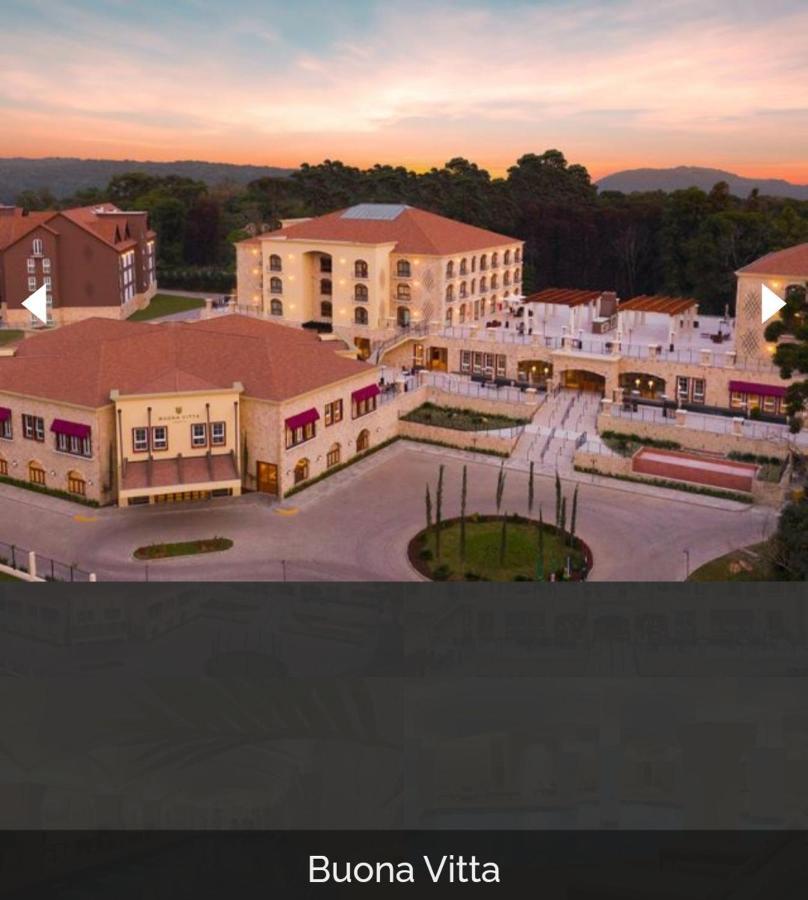 Buona Vitta Gramado Resort & Spa By Gramado Parks Exterior photo The image shows a large, modern building complex, likely a hotel or resort. The architecture features a combination of traditional and contemporary design elements. Surrounding the main building are landscaped areas, including trees and green spaces,